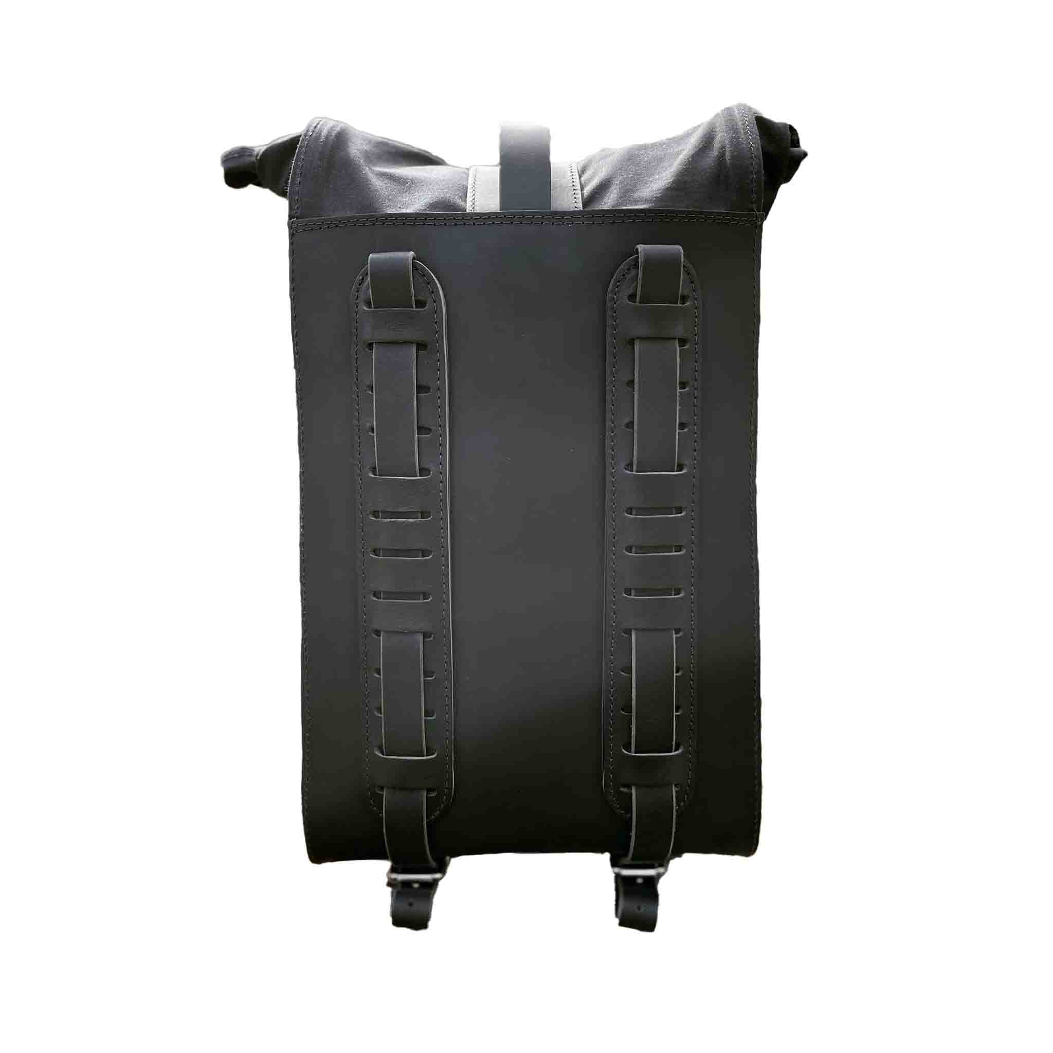 Upgrade your ride with the URB03 Rolltop Backpack Saddlebag. Unique design enables quick conversion from saddlebag to backpack. Hand crafted in USA with premium veg tan water buffalo leather, waxed canvas and stainless steel hardware. Durable and stylish, it's the perfect fit for your motorcycle.